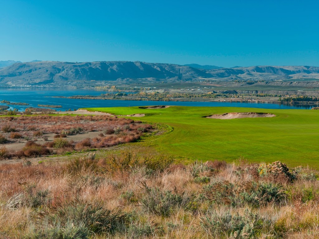 Panoramic view of a lush green golf course at Gamble Sands. Smooth