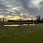 green grass with the flag in the hole.