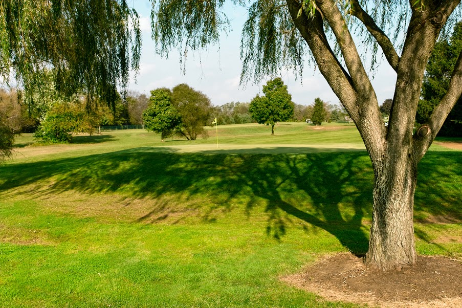 Panoramic view of a lush green golf course at Gambler Ridge Golf Course. Smooth