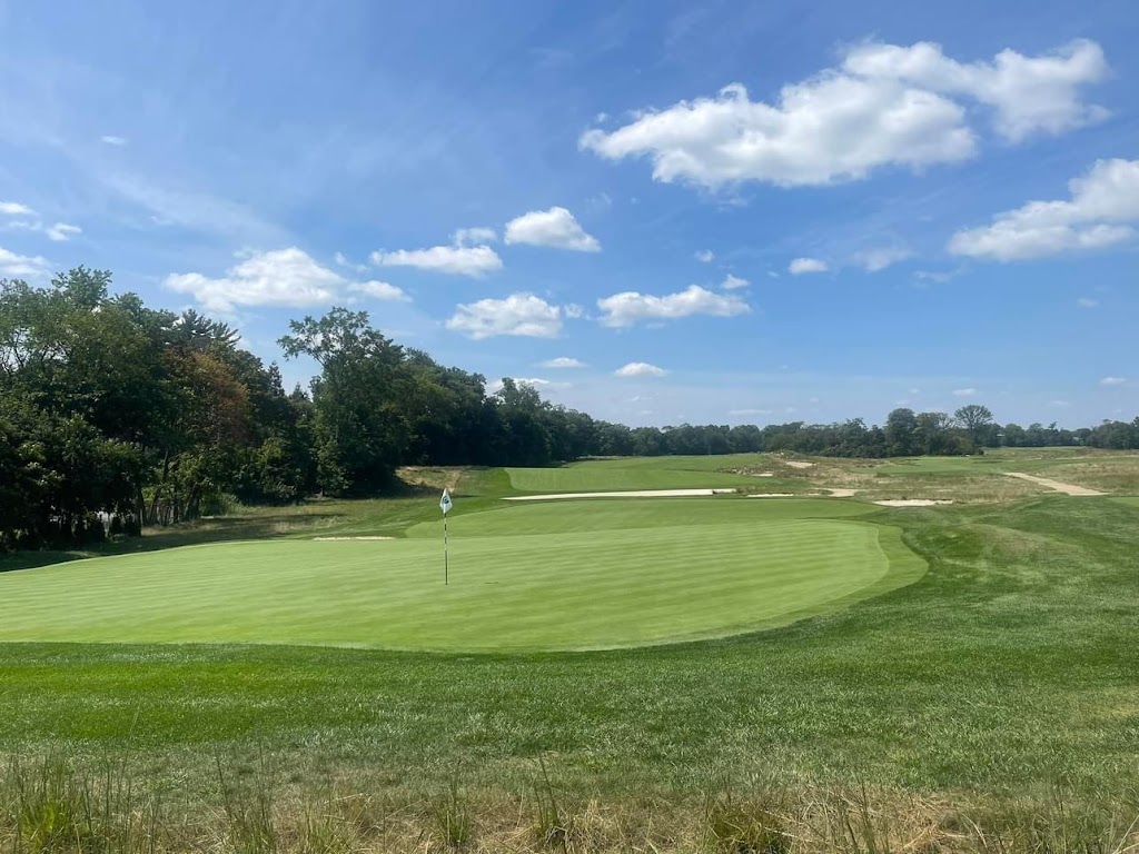 Panoramic view of a lush green golf course at Garden City Golf Club. Smooth