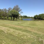 Panoramic view of a lush green golf course at Gardner Golf Course. Smooth