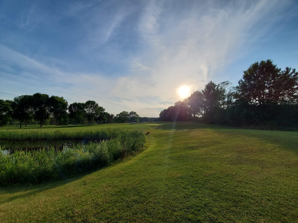Panoramic view of a lush green golf course at Gardner Municipal Golf Course. Smooth