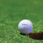 green grass with the flag in the hole.