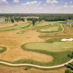 green grass with the flag in the hole.