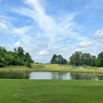 Panoramic view of a lush green golf course at General Burnside Island Golf. Smooth