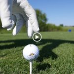 green grass with the flag in the hole.