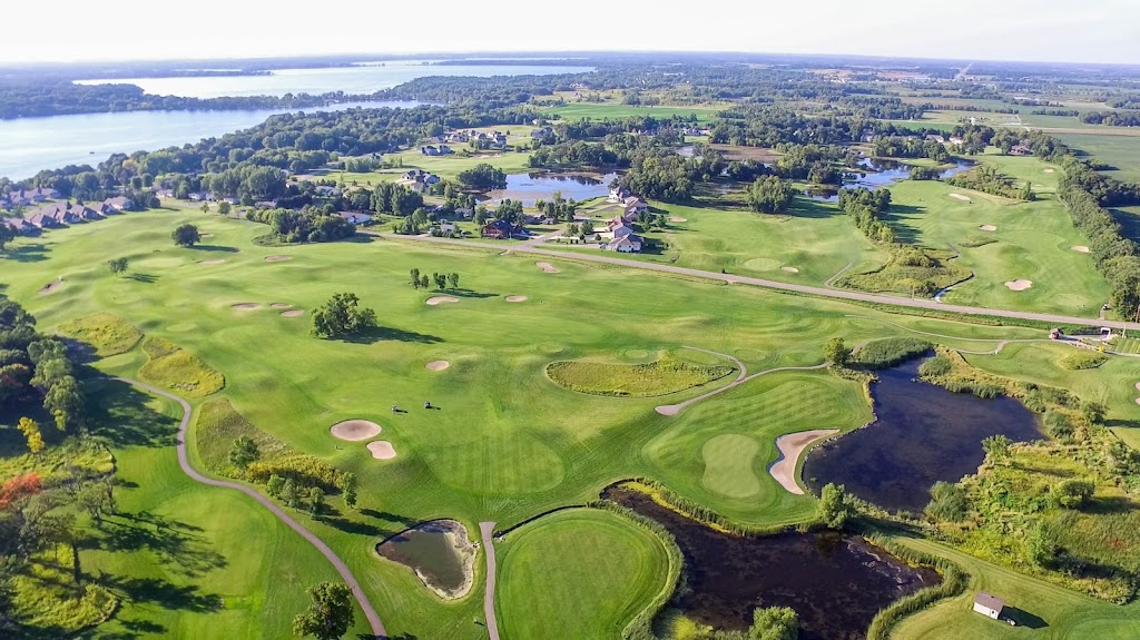 Panoramic view of a lush green golf course at Geneva Golf Club. Smooth