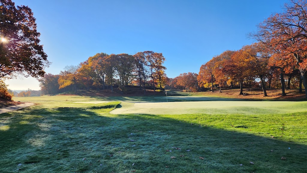 Panoramic view of a lush green golf course at George Wright. Smooth