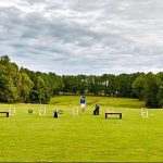 Panoramic view of a lush green golf course at Georgia National Golf Club. Smooth