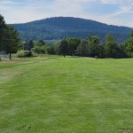 Panoramic view of a lush green golf course at Gettysburg National Golf Club. Smooth