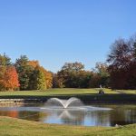 Panoramic view of a lush green golf course at Gillette Ridge Golf Club. Smooth