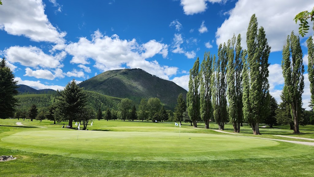 Panoramic view of a lush green golf course at Glacier View Golf Club. Smooth