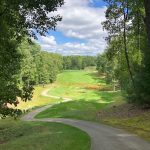 Panoramic view of a lush green golf course at Glade Springs Resort Golf Course. Smooth