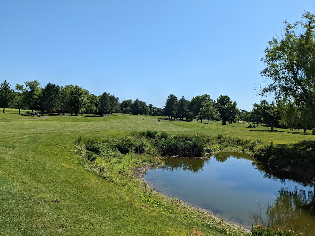 Panoramic view of a lush green golf course at Glade Valley Golf Club. Smooth