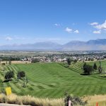 Panoramic view of a lush green golf course at Gladstan Golf Course. Smooth