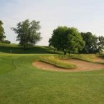 Panoramic view of a lush green golf course at Glen Erin Golf Club. Smooth