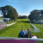 Panoramic view of a lush green golf course at Glen Oaks Club. Smooth