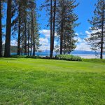 Panoramic view of a lush green golf course at Glenbrook Club. Smooth