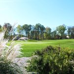 Panoramic view of a lush green golf course at Gleneagles Golf Club & Events. Smooth