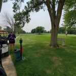 Panoramic view of a lush green golf course at Glenridge Golf Course. Smooth