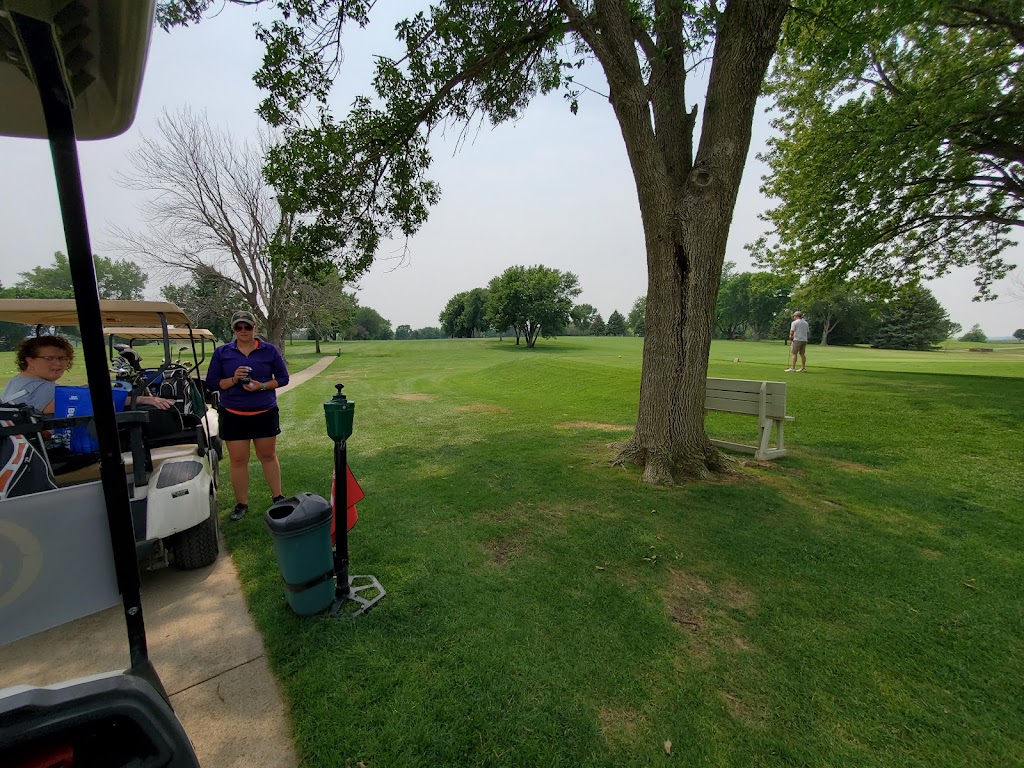 Panoramic view of a lush green golf course at Glenridge Golf Course. Smooth