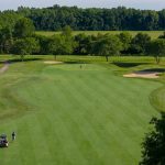 Panoramic view of a lush green golf course at Glenross Golf Club. Smooth