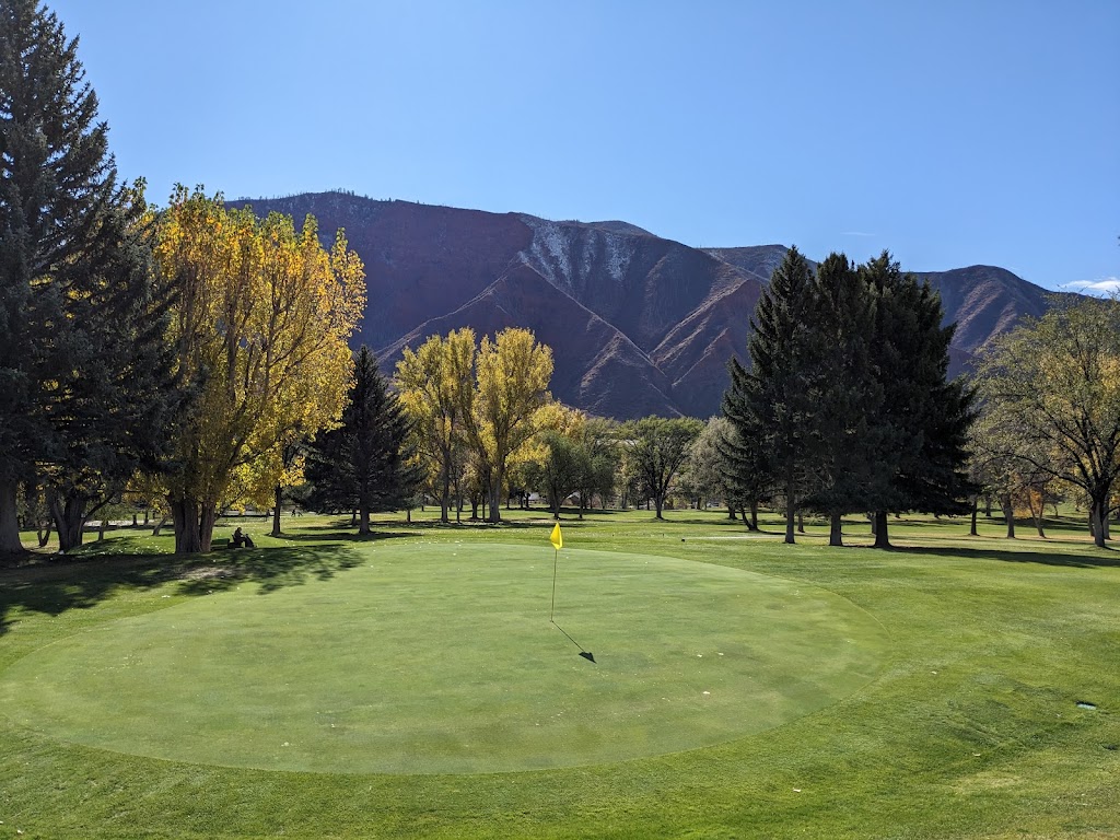 Panoramic view of a lush green golf course at Glenwood Springs Golf Club. Smooth