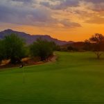 Panoramic view of a lush green golf course at Gold Canyon Golf Course. Smooth