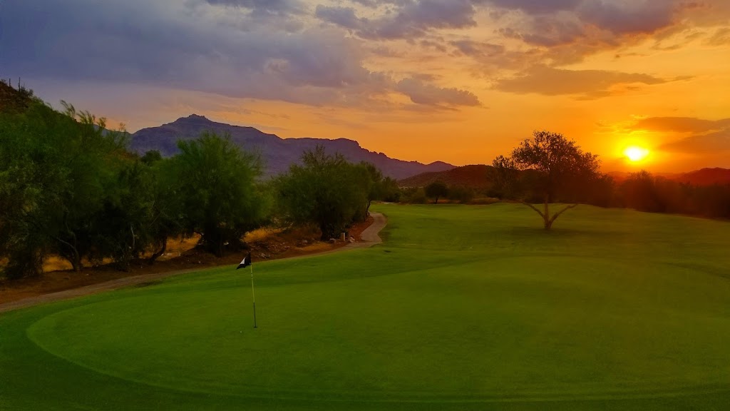 Panoramic view of a lush green golf course at Gold Canyon Golf Course. Smooth