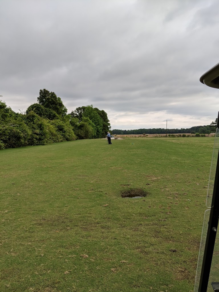 Panoramic view of a lush green golf course at Goldsboro Golf Course. Smooth