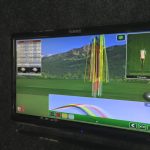 Panoramic view of a lush green golf course at Golf Anytime. Smooth