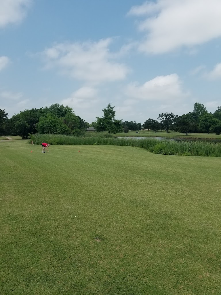 Panoramic view of a lush green golf course at Golf Club At Cimarron Trails. Smooth