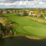 green grass with the flag in the hole.