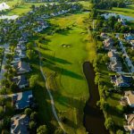 Panoramic view of a lush green golf course at Golf Club of Dublin. Smooth