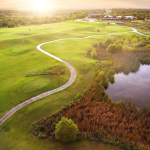 Panoramic view of a lush green golf course at Golf Club of Texas - San Antonio. Smooth