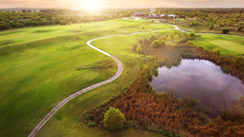 Panoramic view of a lush green golf course at Golf Club of Texas - San Antonio. Smooth
