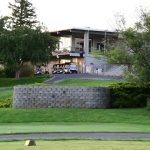 Panoramic view of a lush green golf course at Golf Course at Birch Creek. Smooth