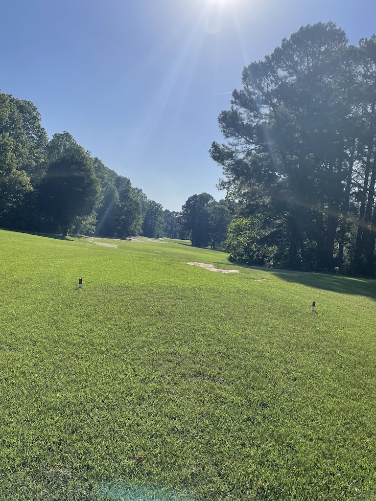 Panoramic view of a lush green golf course at Golf North Hills. Smooth