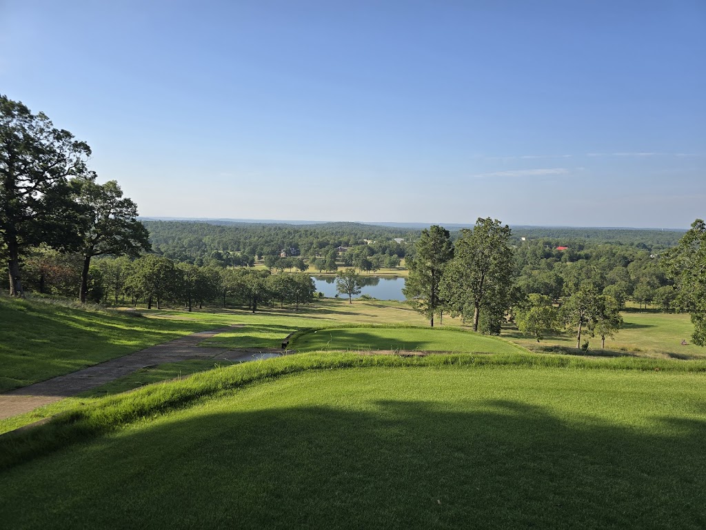 Panoramic view of a lush green golf course at Golf on Turkey Mountain. Smooth