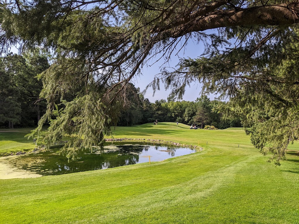 Panoramic view of a lush green golf course at Goodrich Golf Course. Smooth