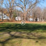 Panoramic view of a lush green golf course at Goodwin Park Golf Course. Smooth