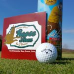 green grass with the flag in the hole.