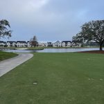 green grass with the flag in the hole.