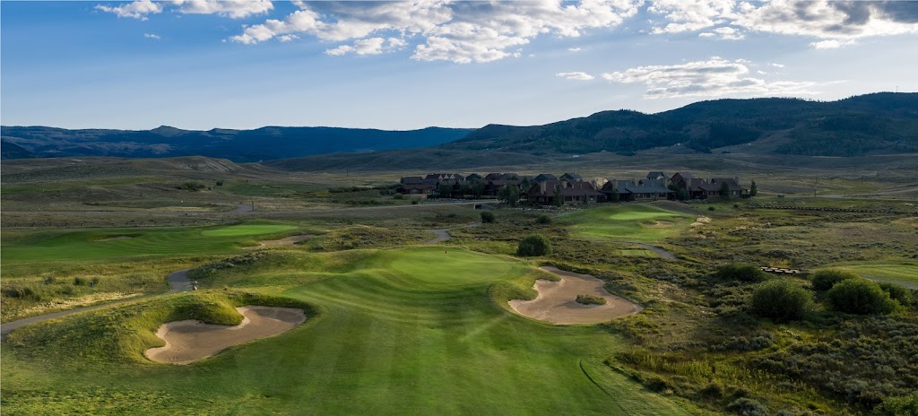 Panoramic view of a lush green golf course at Grand Elk Golf Club. Smooth