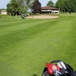 Panoramic view of a lush green golf course at Grand View Golf Club. Smooth