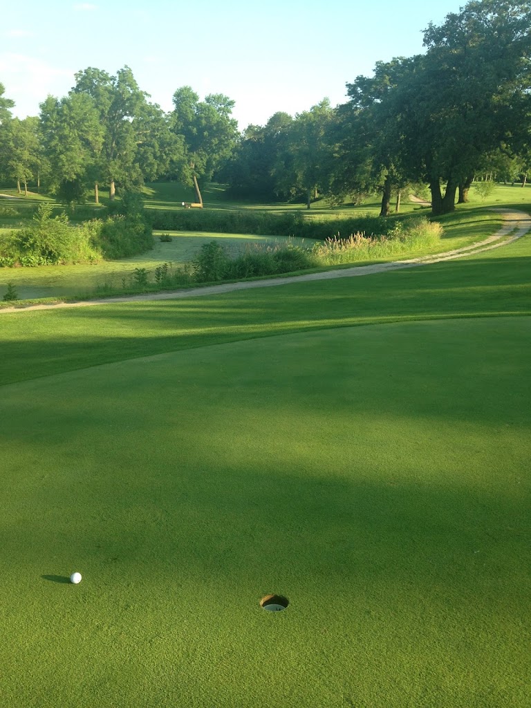 Panoramic view of a lush green golf course at Grandpas Woods Golf Course. Smooth