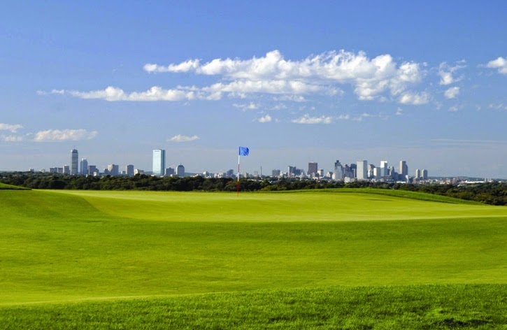 Panoramic view of a lush green golf course at Granite Links. Smooth
