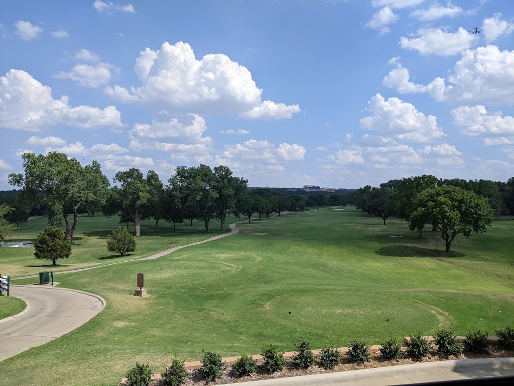 Panoramic view of a lush green golf course at Grapevine Golf Course. Smooth