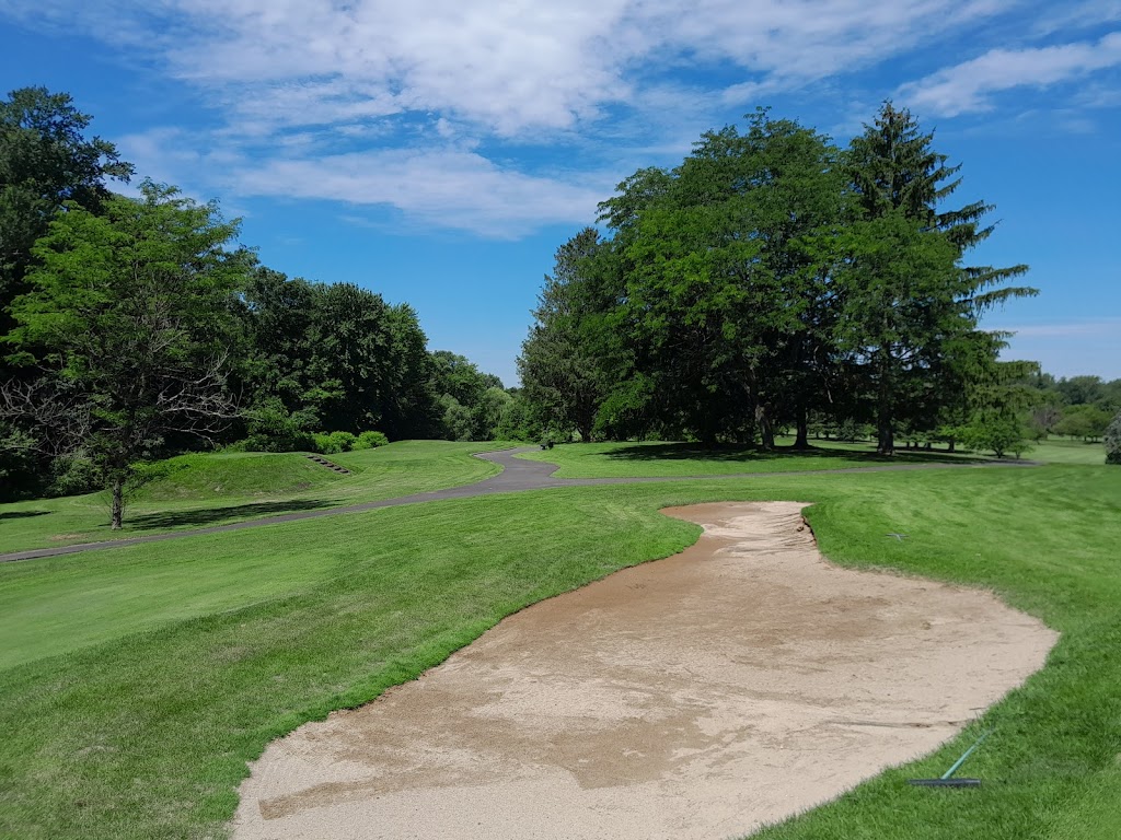 Panoramic view of a lush green golf course at Grassmere Country Club. Smooth