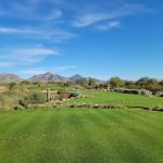 Panoramic view of a lush green golf course at Grayhawk Golf Club. Smooth